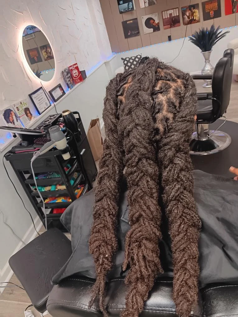 Long textured protective twists created by Elegant African Braiding